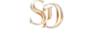 Refined gold and glass interlinked "SD" monogram logo representing Suzanne Dufault and her specialized Premium Brand Strategy services.